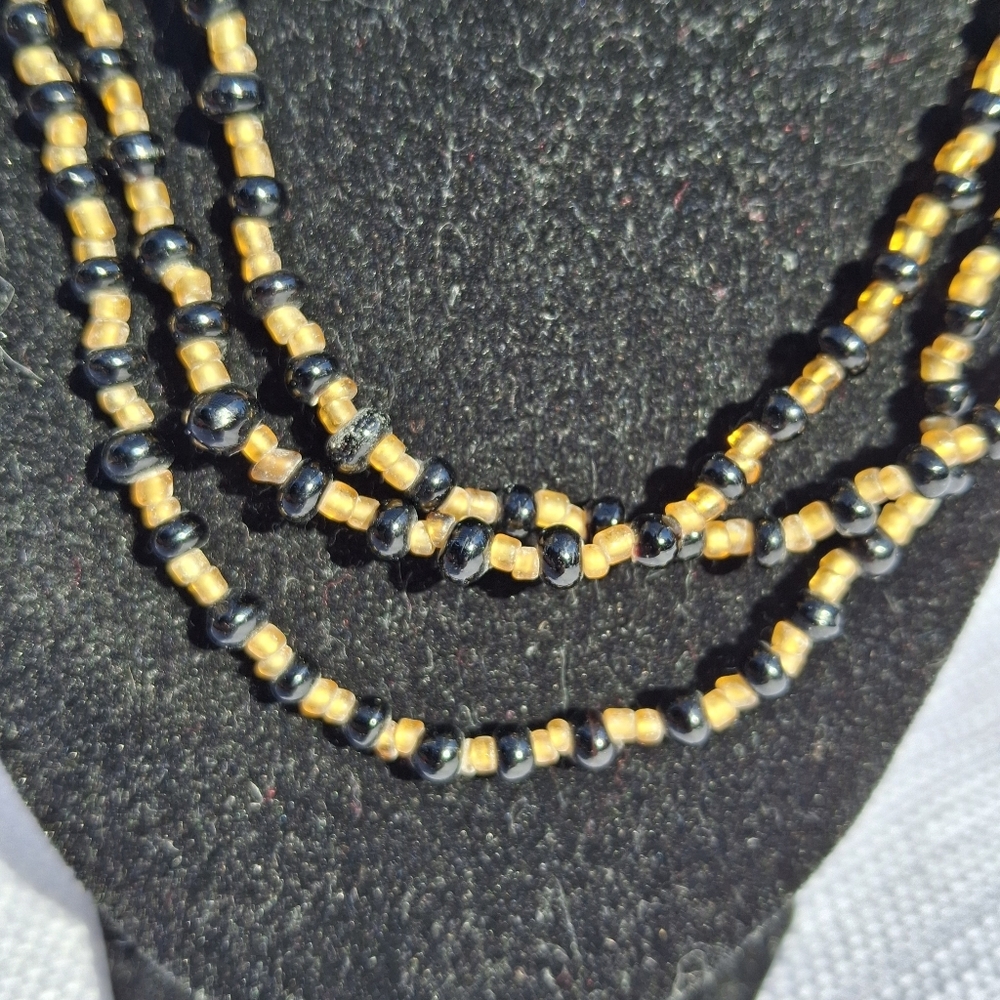 Long Black and Gold Beaded Necklace
